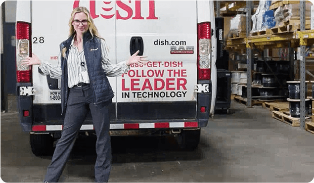 Region manager standing in front of DISH van
