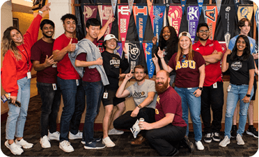 Various employees dressed in college gear