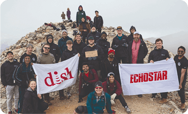 Team at top of a mountain 