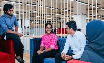 Coworkers chatting on a couch