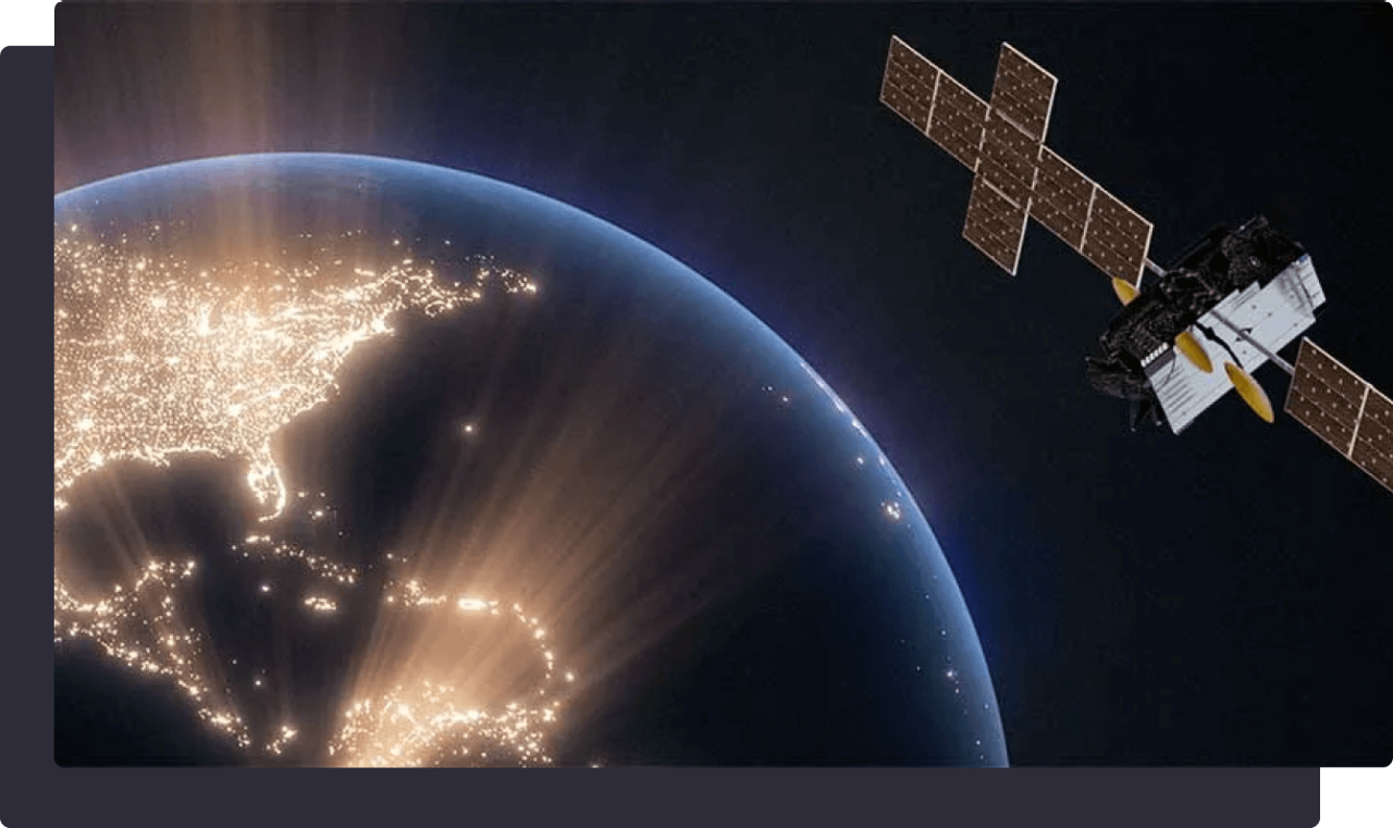 A satellite orbiting Earth, with North and South America illuminated by bright city lights at night.